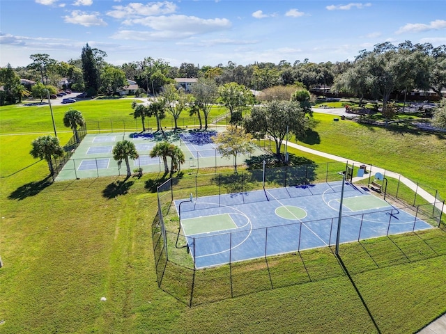 view of basketball court featuring a lawn