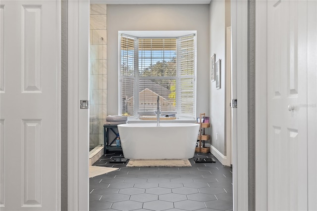 bathroom featuring tile patterned floors and independent shower and bath