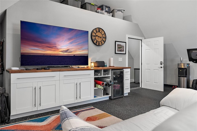 living room with beverage cooler and high vaulted ceiling