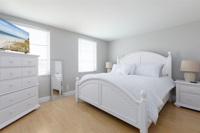 bedroom with light hardwood / wood-style flooring