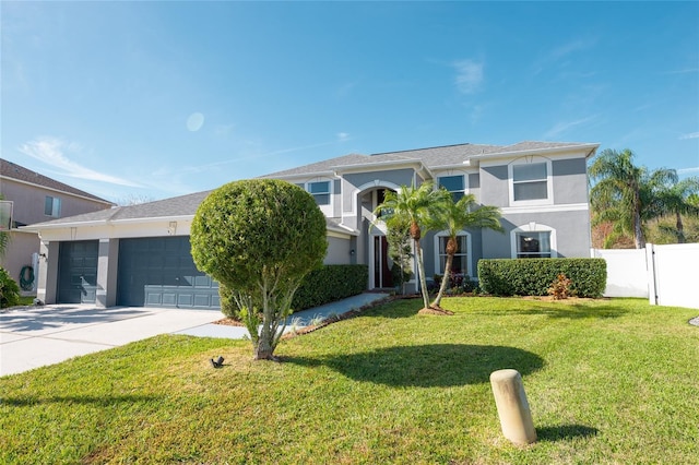 view of front of property featuring a garage and a front yard