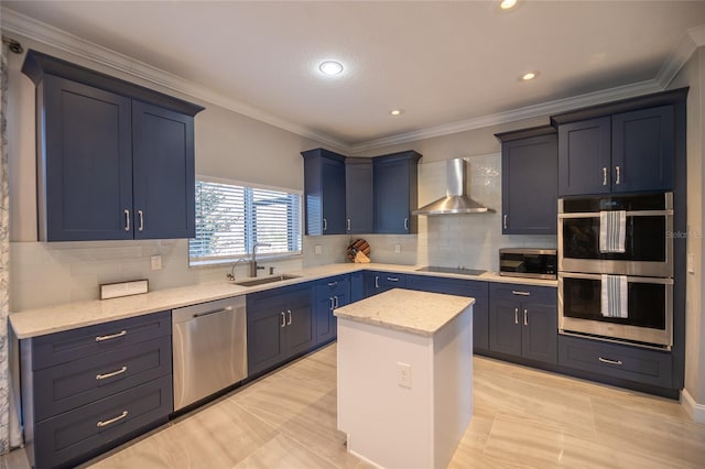 kitchen with sink, crown molding, a center island, appliances with stainless steel finishes, and wall chimney range hood