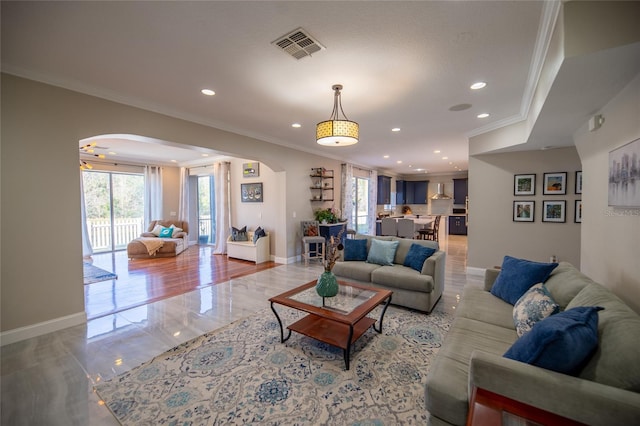 living room with ornamental molding