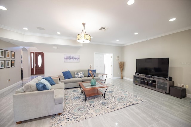 living room with ornamental molding