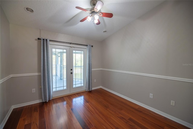 doorway to outside with dark wood-type flooring, ceiling fan, french doors, and a textured ceiling