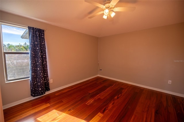 spare room featuring hardwood / wood-style flooring and ceiling fan