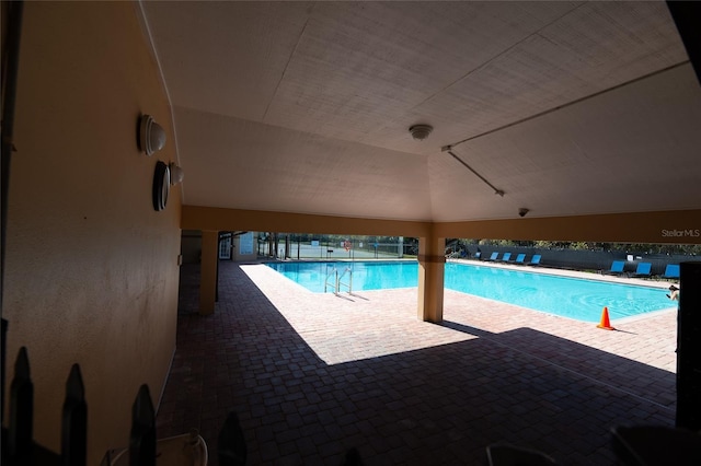 view of swimming pool featuring a patio