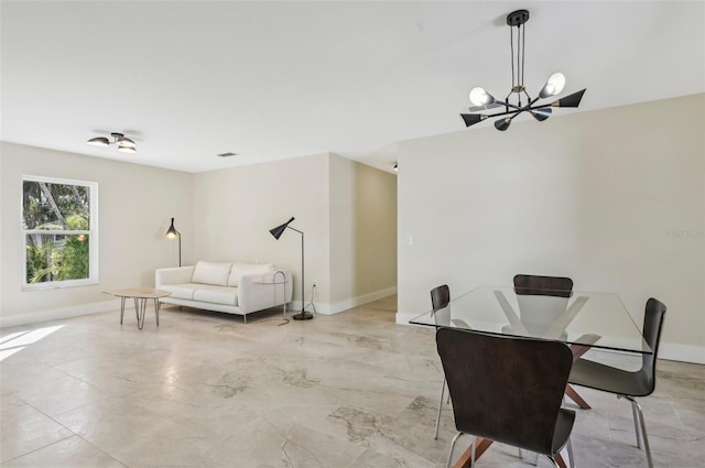 dining area featuring an inviting chandelier