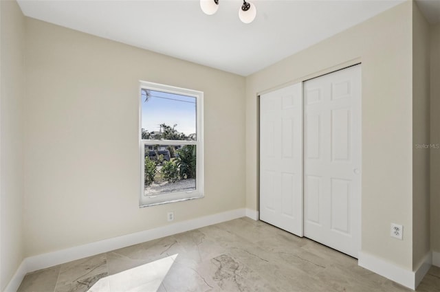 unfurnished bedroom with a closet