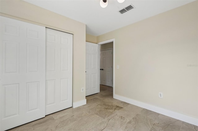 unfurnished bedroom with a closet