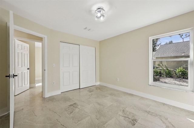 unfurnished bedroom featuring a closet