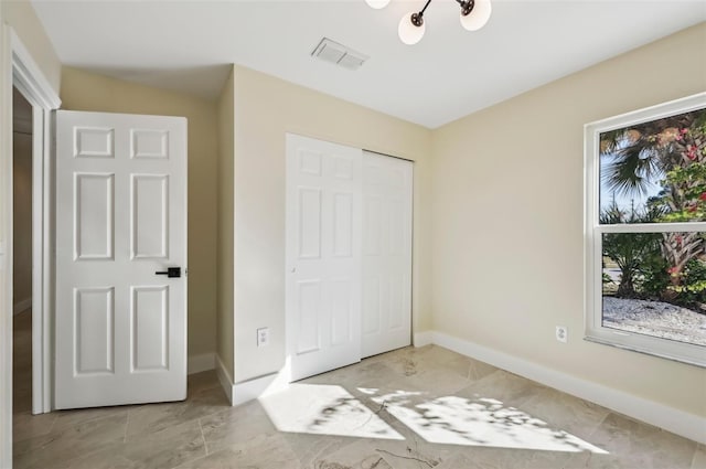 unfurnished bedroom with a closet