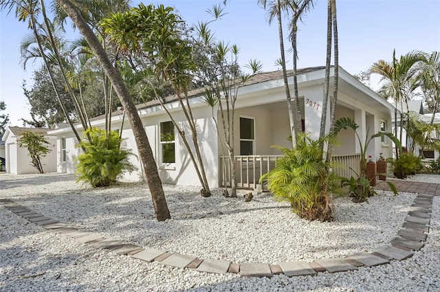 view of property exterior with covered porch