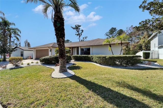 single story home featuring a garage and a front lawn