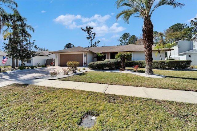 view of front of property featuring a garage and a front lawn