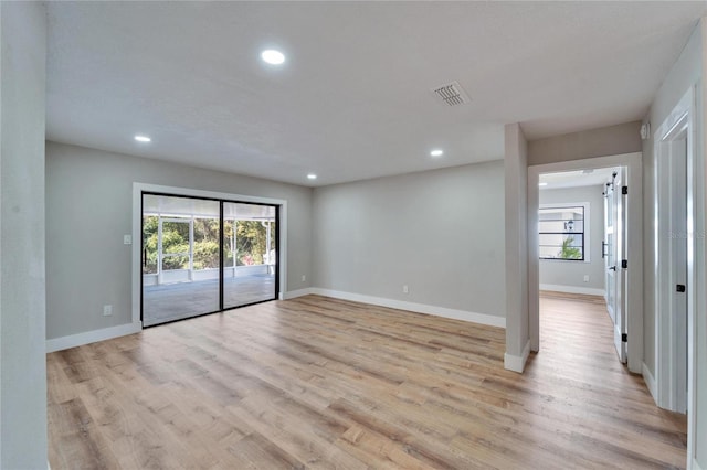 spare room featuring light hardwood / wood-style flooring