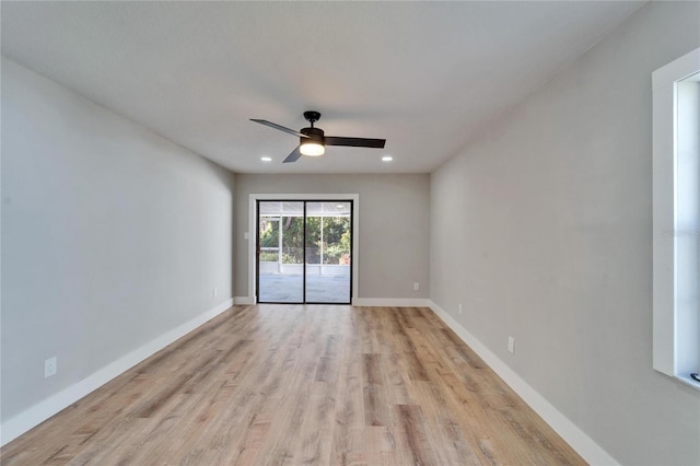 empty room featuring ceiling fan and light wood-type flooring