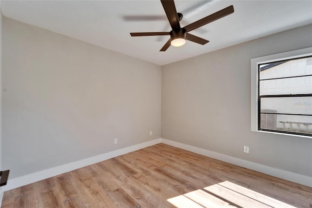 unfurnished room with ceiling fan and light hardwood / wood-style flooring