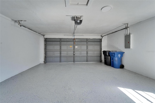 garage featuring a garage door opener and electric panel