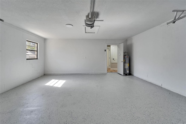 garage featuring a garage door opener and electric water heater