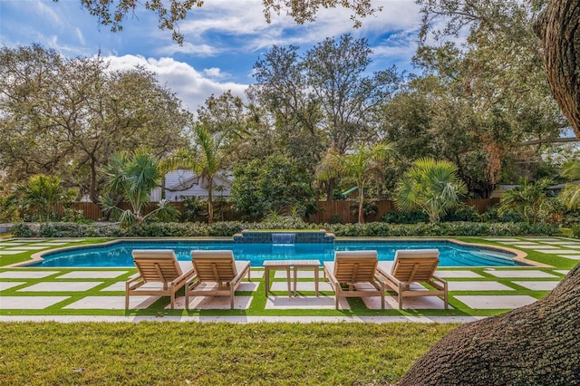 view of swimming pool featuring a lawn