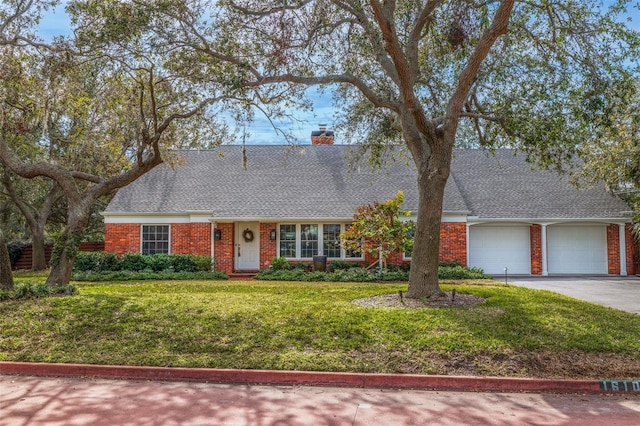 single story home with a garage and a front lawn