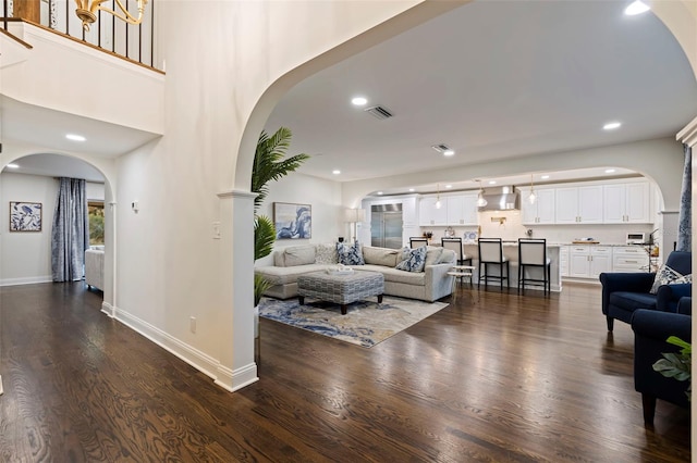 living room with dark hardwood / wood-style flooring