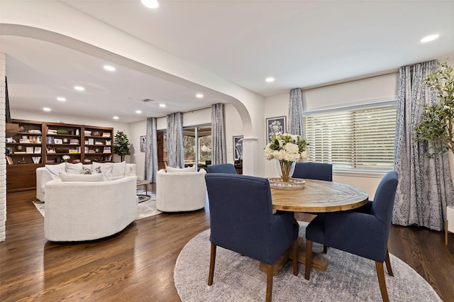 dining space featuring dark wood-type flooring