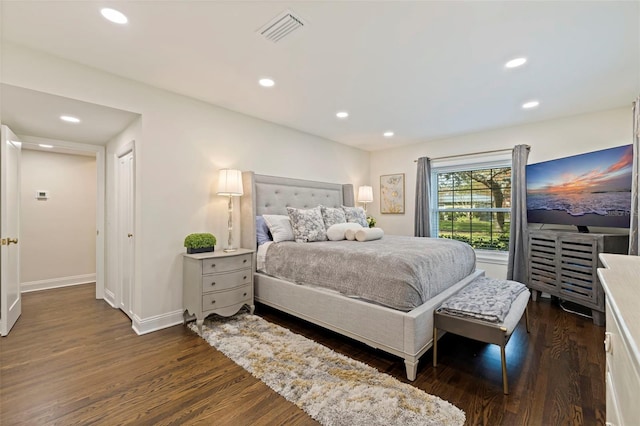 bedroom with dark wood-type flooring