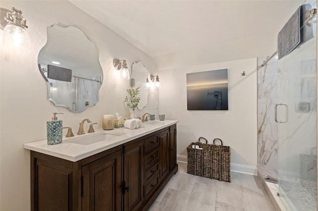 bathroom with vanity and a shower with shower door