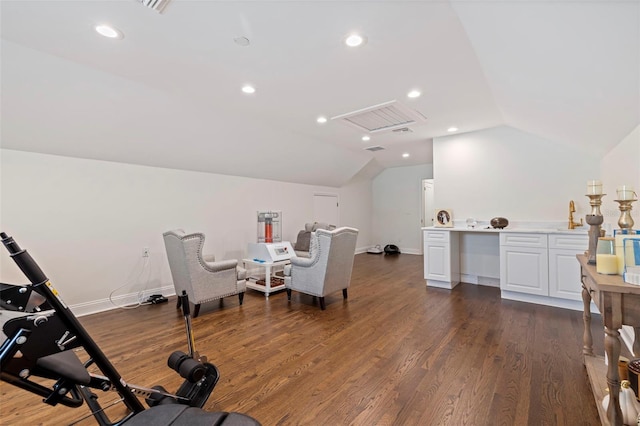 exercise area with lofted ceiling and dark hardwood / wood-style flooring