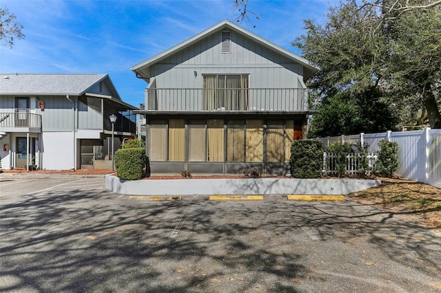 back of property featuring a balcony