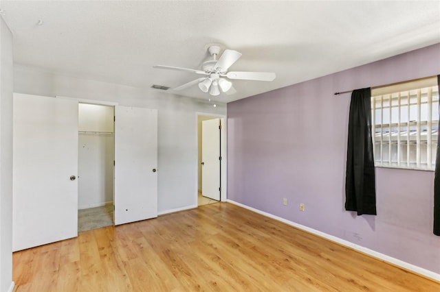 unfurnished bedroom featuring light hardwood / wood-style flooring and ceiling fan