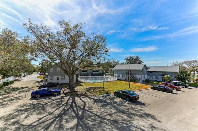 view of front of house with a swimming pool