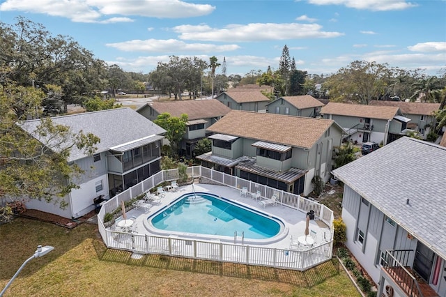 view of swimming pool featuring a patio area and a lawn