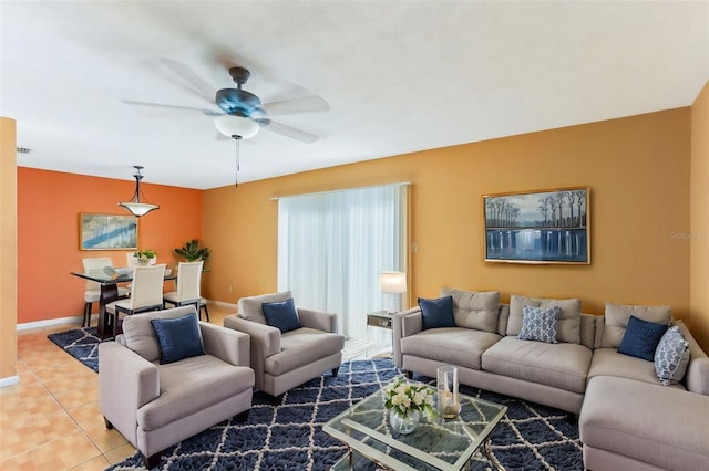 tiled living room with ceiling fan