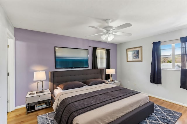 bedroom featuring hardwood / wood-style floors and ceiling fan