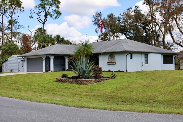 ranch-style house featuring a garage and a front yard