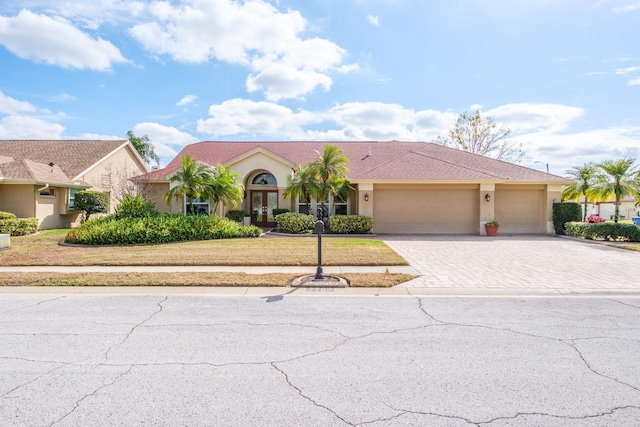 view of front of home featuring a garage and a front yard