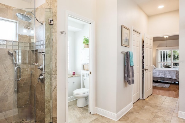 bathroom with an enclosed shower and toilet