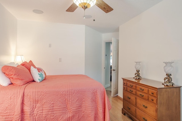 bedroom with ceiling fan and light wood-type flooring