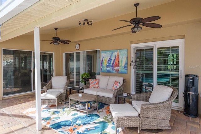 view of patio / terrace featuring an outdoor living space and ceiling fan