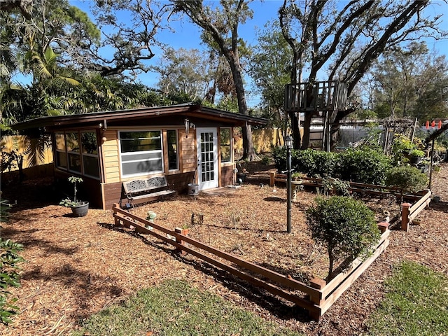 exterior space featuring a garden