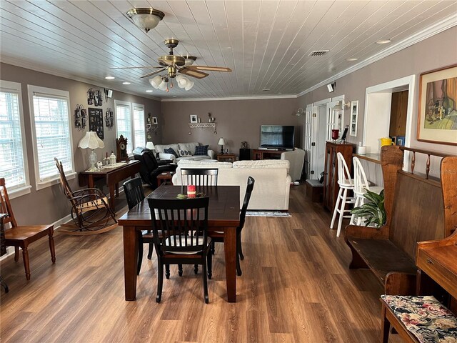 dining space featuring wood ceiling, visible vents, crown molding, and wood finished floors