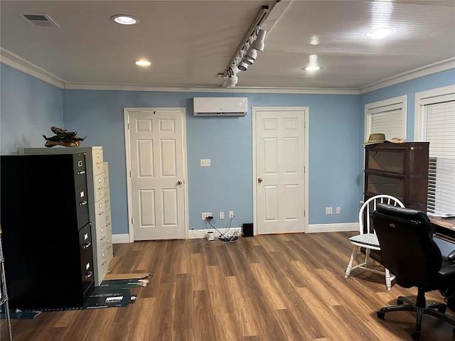 office area with an AC wall unit, wood finished floors, visible vents, and crown molding