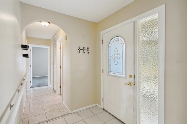 foyer featuring light tile patterned floors