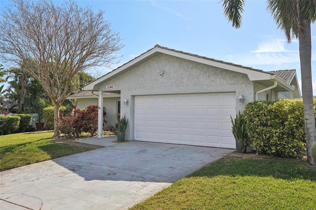 single story home featuring a garage and a front lawn