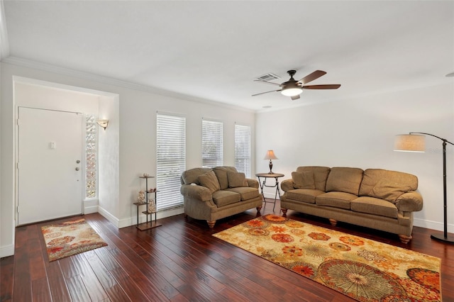 living room with crown molding, ceiling fan, and dark hardwood / wood-style flooring