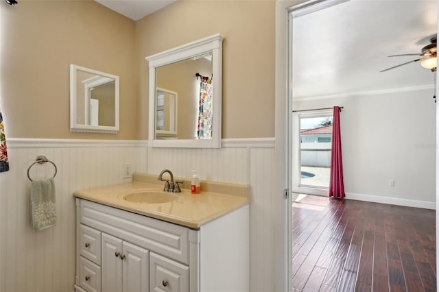 bathroom with vanity, hardwood / wood-style floors, and ceiling fan