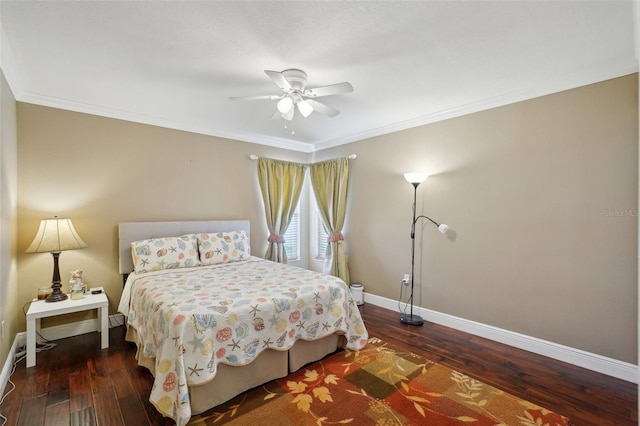 bedroom with dark hardwood / wood-style flooring, crown molding, and ceiling fan